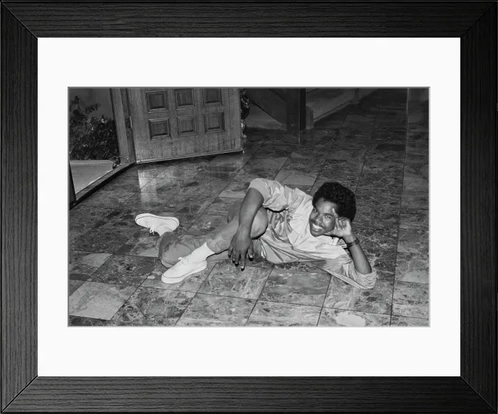 Framed Print : Breakin. A breakdancer reclining on a marble-effect tiled floor, United States, circa 1985 Framed Print : Breakin. A breakdancer reclining on a marble-effect tiled floor, United States, circa 1985