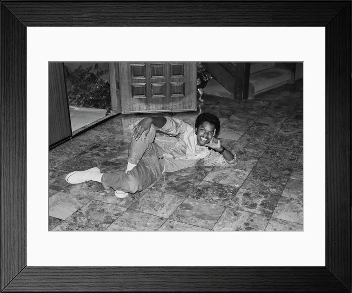 Framed Print : Breakin. A breakdancer reclining on a marble-effect tiled floor, United States, circa 1985 Framed Print : Breakin. A breakdancer reclining on a marble-effect tiled floor, United States, circa 1985
