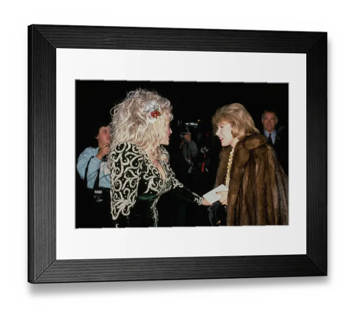 Framed Print : Dolly Parton And Joan Rivers Attend Sandy Gallin's Christmas Party Framed Print : Dolly Parton And Joan Rivers Attend Sandy Gallin's Christmas Party
