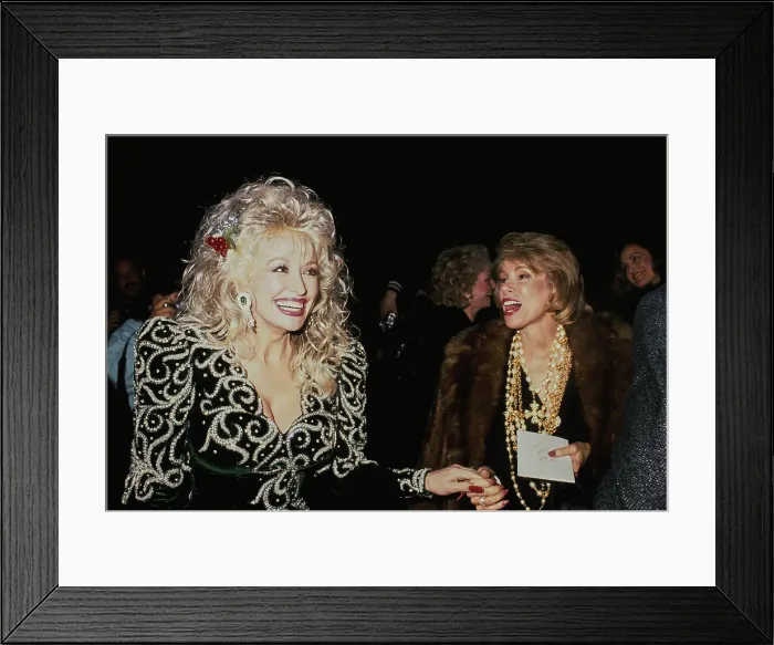 Framed Print : Dolly Parton And Joan Rivers Attend Sandy Gallin's Christmas Party Framed Print : Dolly Parton And Joan Rivers Attend Sandy Gallin's Christmas Party