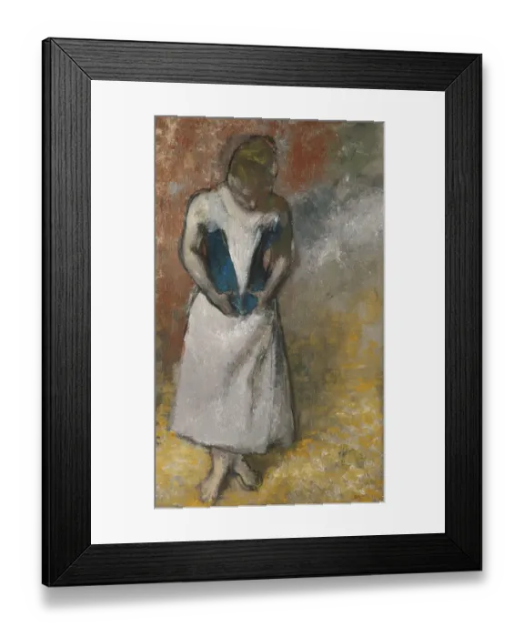 Framed Print : Woman standing from the front, clasping her corset, ca Framed Print : Woman standing from the front, clasping her corset, ca
