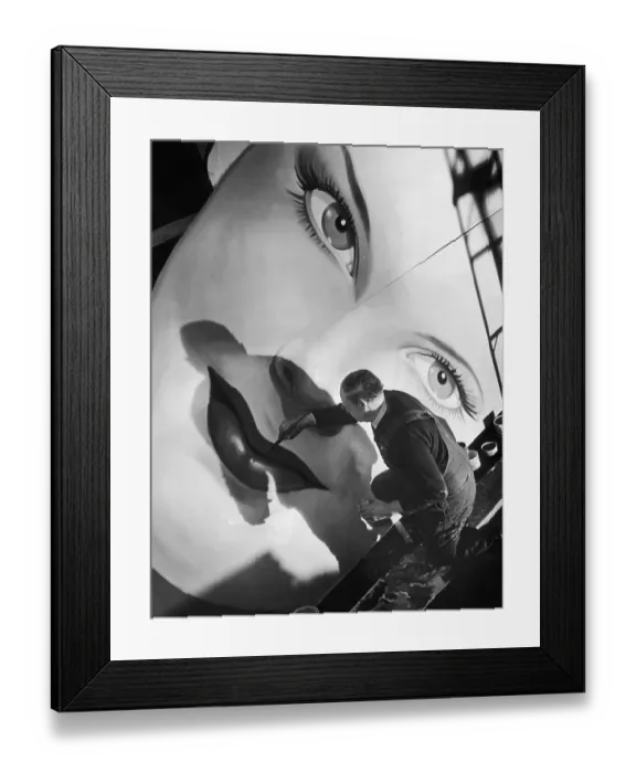 Framed Print : Facelift. A painter fills in a woman's lips on large billboard Framed Print : Facelift. A painter fills in a woman's lips on large billboard