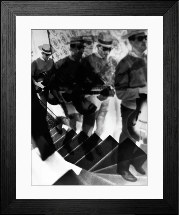 Framed Print : Photo Montage of Serenading Man Climbing Stairs in 1960's Framed Print : Photo Montage of Serenading Man Climbing Stairs in 1960's