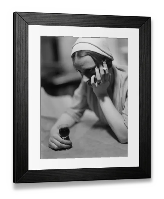 Framed Print : Stood-Up. circa 1930: A young woman drowning her sorrows Framed Print : Stood-Up. circa 1930: A young woman drowning her sorrows