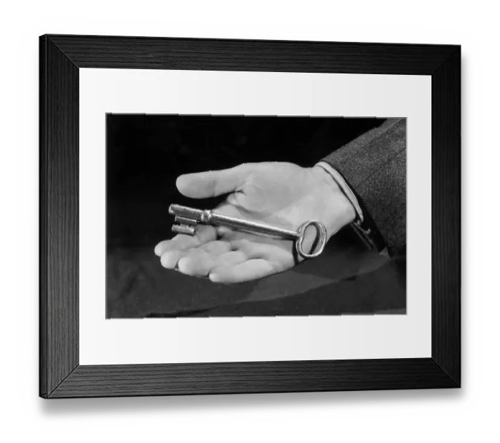 Framed Print : Handy Key. circa 1945: Closeup of a man's hand holding a large key Framed Print : Handy Key. circa 1945: Closeup of a man's hand holding a large key
