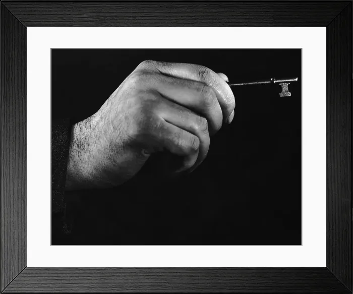Framed Print : Unlocking. 1941: Close-up of a man's hand holding a key. (Photo by Hirz / Getty Images) Framed Print : Unlocking. 1941: Close-up of a man's hand holding a key. (Photo by Hirz / Getty Images)