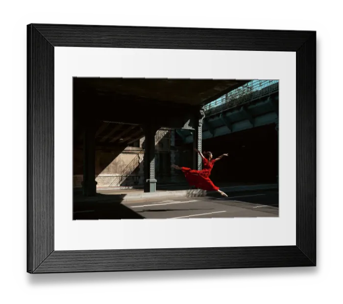 Framed Print : Female ballet dancer dancing with pointes in the street with a long red dress Framed Print : Female ballet dancer dancing with pointes in the street with a long red dress