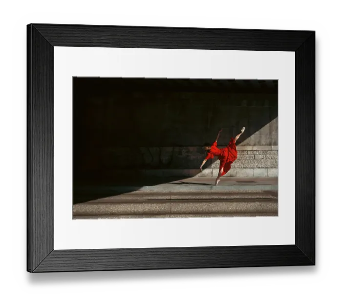 Framed Print : Female ballet dancer dancing with pointes in the street with a long red dress Framed Print : Female ballet dancer dancing with pointes in the street with a long red dress