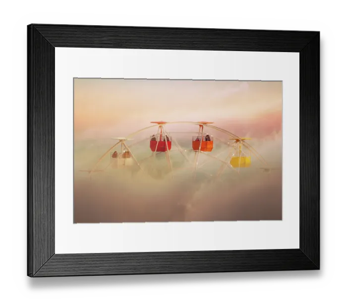 Framed Print : Surreal picture of colorful ferris wheel emerging from the clouds Framed Print : Surreal picture of colorful ferris wheel emerging from the clouds