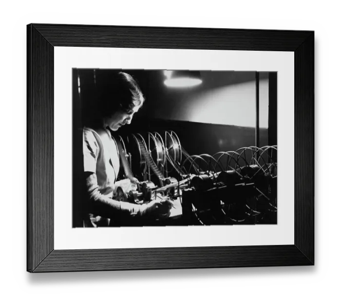 Framed Print : Woman Editing Film Framed Print : Woman Editing Film