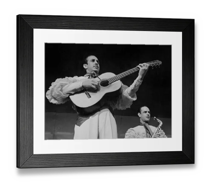 Framed Print : Hey Mambo. Low angle view of a man playing an acoustic guitar Framed Print : Hey Mambo. Low angle view of a man playing an acoustic guitar