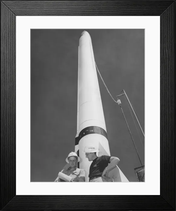 Framed Print : A Rocket. Two men in hard hats stand beside a rocket circa 1950 Framed Print : A Rocket. Two men in hard hats stand beside a rocket circa 1950