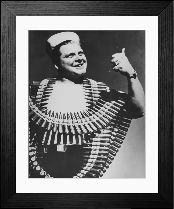 Framed Print : Sailor. A sailor wears ammunition belts around his chest, circa 1940s