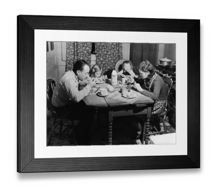 Framed Print : Family Eats Meal At Small Wooden Table Framed Print : Family Eats Meal At Small Wooden Table