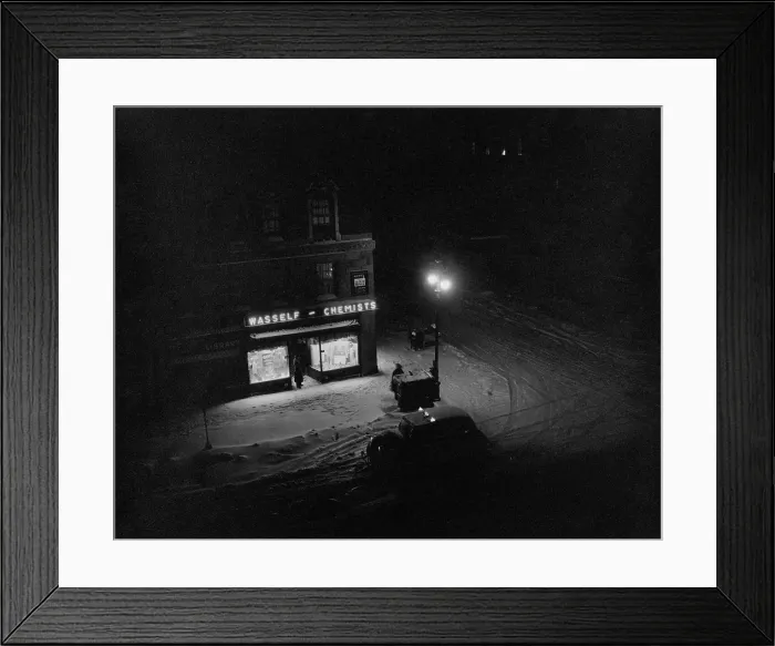 Framed Print : Illuminated Street Corner With Chemist's Shop Framed Print : Illuminated Street Corner With Chemist's Shop