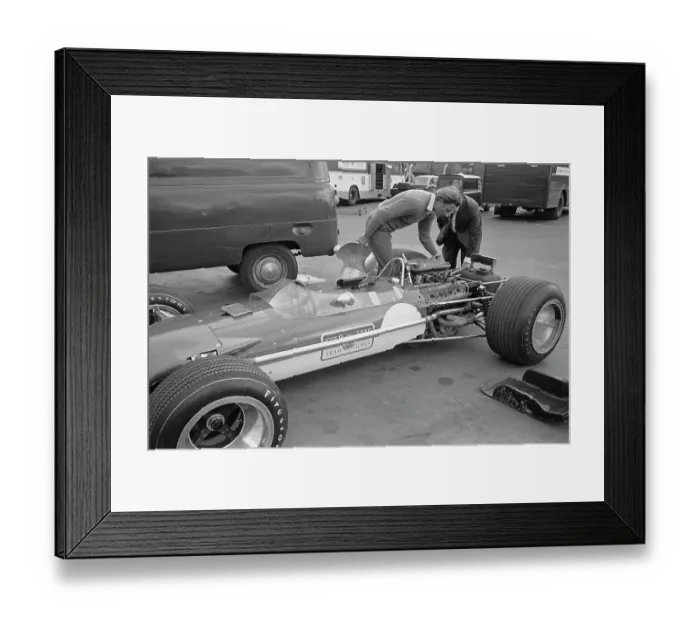 Framed Print : Graham Hill Inspects Car