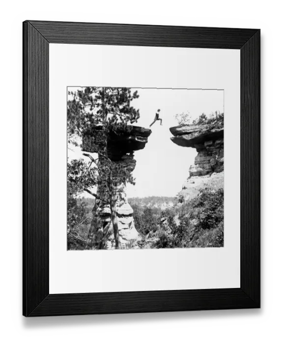 Framed Print : Historic photograph of man leaping between boulder in mid-air Framed Print : Historic photograph of man leaping between boulder in mid-air