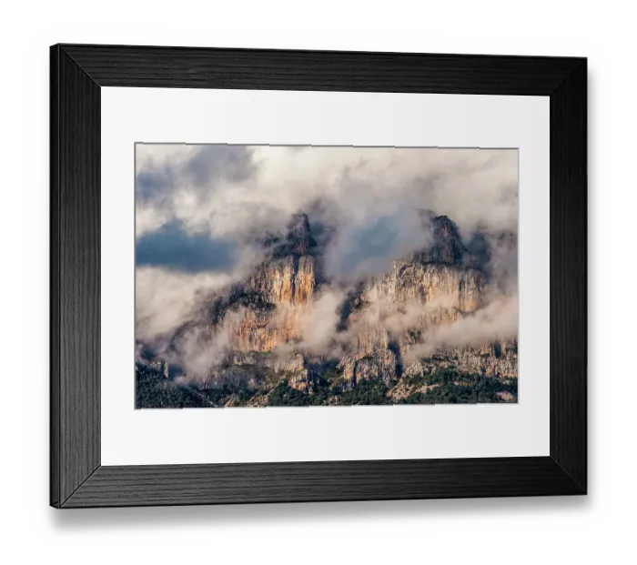 Framed Print : The Peña mountains to the north of Ainsa, Spain partially covered in clouds during dusk Framed Print : The Peña mountains to the north of Ainsa, Spain partially covered in clouds during dusk