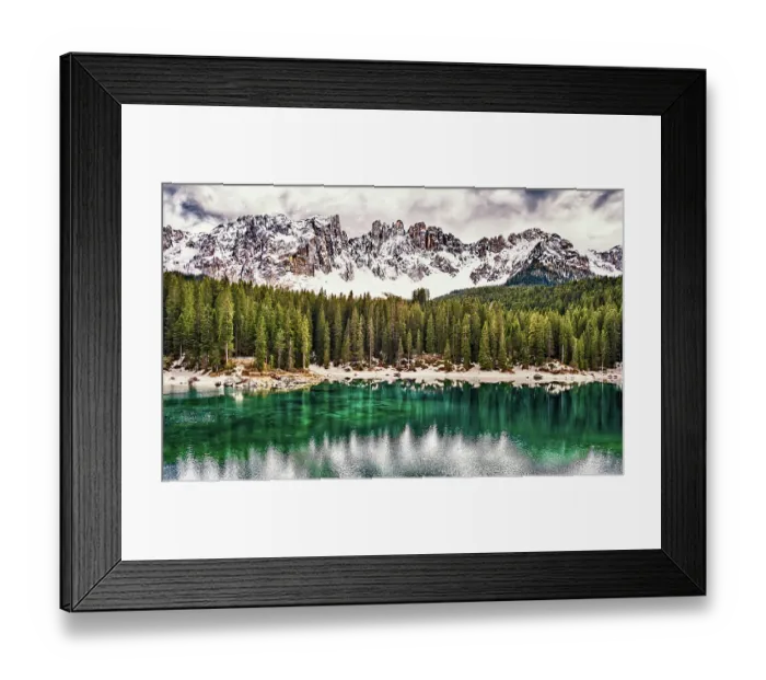 Framed Print : The emerald green Lake Carezza reflects the trees in the western Dolomite mountains of northern Italy Framed Print : The emerald green Lake Carezza reflects the trees in the western Dolomite mountains of northern Italy