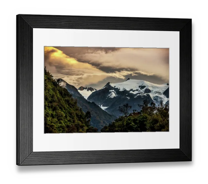 Framed Print : The sun setting over the Franz Josef glacier located on the south island of New Zealand Framed Print : The sun setting over the Franz Josef glacier located on the south island of New Zealand