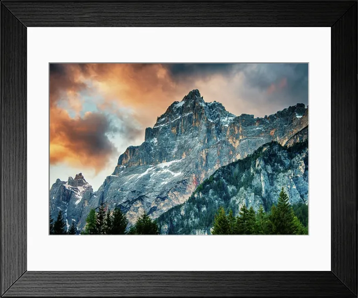 Framed Print : The sun sets on a peak in the Dolomite mountains of Italy Framed Print : The sun sets on a peak in the Dolomite mountains of Italy