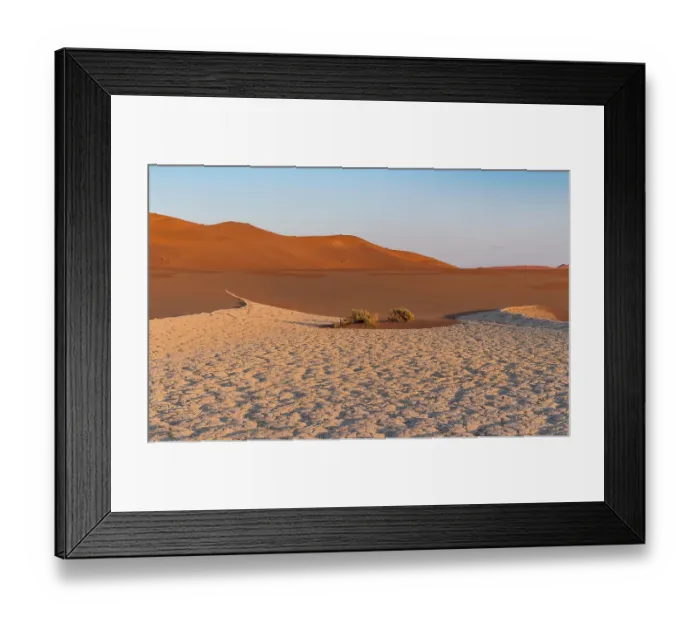 Framed Print : Parched ground in front of sand dunes Framed Print : Parched ground in front of sand dunes