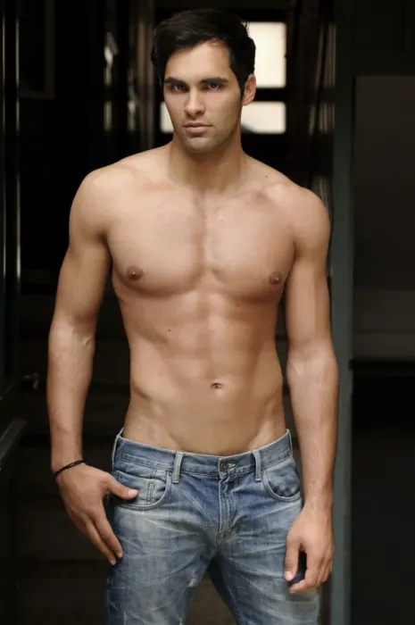 Framed Print : 21-year-old mediterranean-looking man, wearing jeans, bare upper body, in corridor Framed Print : 21-year-old mediterranean-looking man, wearing jeans, bare upper body, in corridor