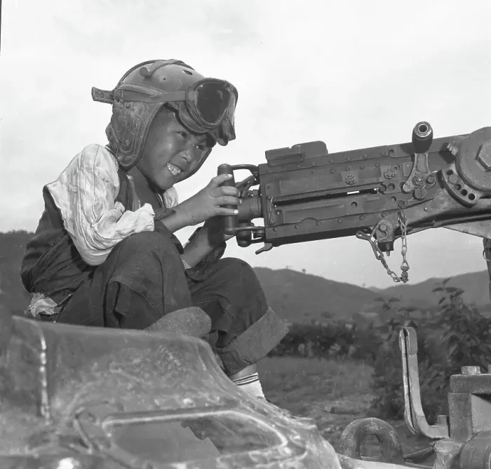 Framed Print : 24th Infantry Division's Adopted Child Al Pretends To Shoot On A Tank Framed Print : 24th Infantry Division's Adopted Child Al Pretends To Shoot On A Tank