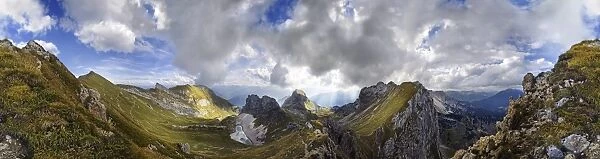 360A view from Seekarlscharte Mountain with Gruba Lake and bizarre clouds in the sky over the Rofan Mountains, Achensee, Tyrol, Austria, Europe