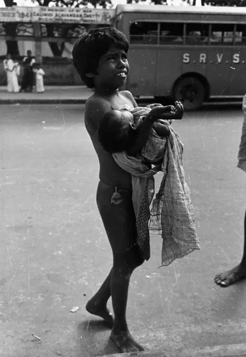 Framed Print : Please !. 8th March 1947: A young child carrying a baby begs in the streets Framed Print : Please !. 8th March 1947: A young child carrying a baby begs in the streets
