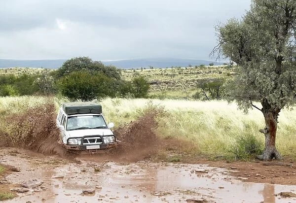 4x4 Vehicle Splashing Through Mud