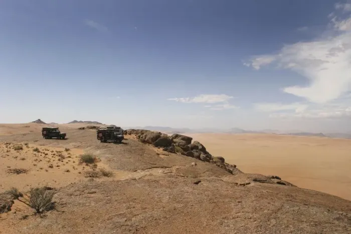 Framed Print : 4X4 Vehicles Overlooking a Vast Desert Landscape Framed Print : 4X4 Vehicles Overlooking a Vast Desert Landscape