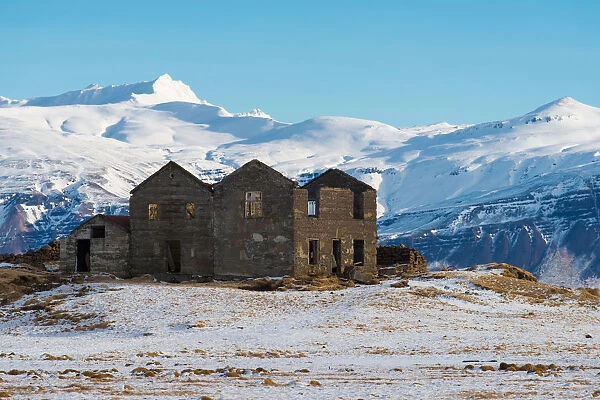 Abandoned house with the snowy mountain