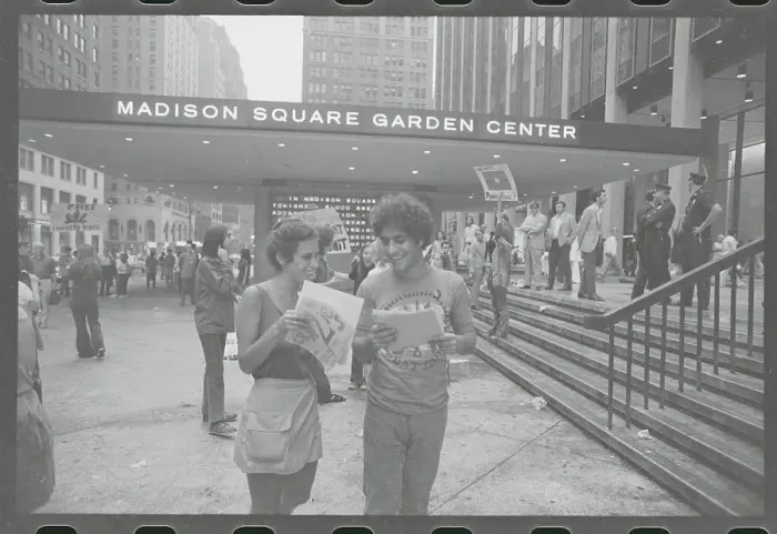 Framed Print : Abbie Hoffman Conversing with Young Lady Framed Print : Abbie Hoffman Conversing with Young Lady