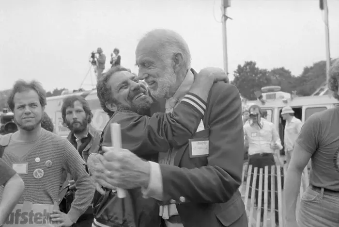 Framed Print : Abbie Hoffman Hugging Dr. Benjamin Spock