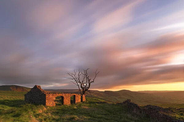 Abondoned cottage in ruin at sunrise. English Peak District. UK