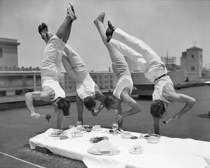 Framed Print : Acrobats Eat While Doing Handstands Framed Print : Acrobats Eat While Doing Handstands