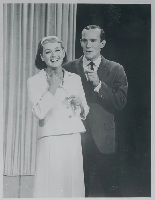  : Actress Bette Davis Posing With Comedian Tom Smothers