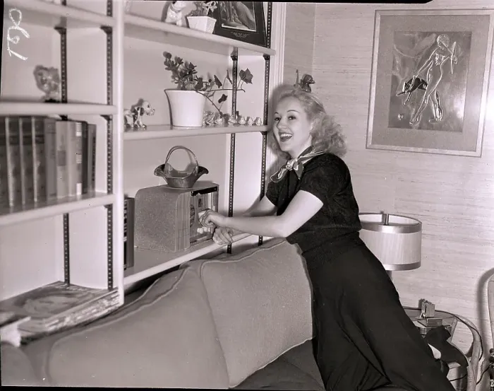 Framed Print : Actress Betty Grable Turning on Radio Framed Print : Actress Betty Grable Turning on Radio