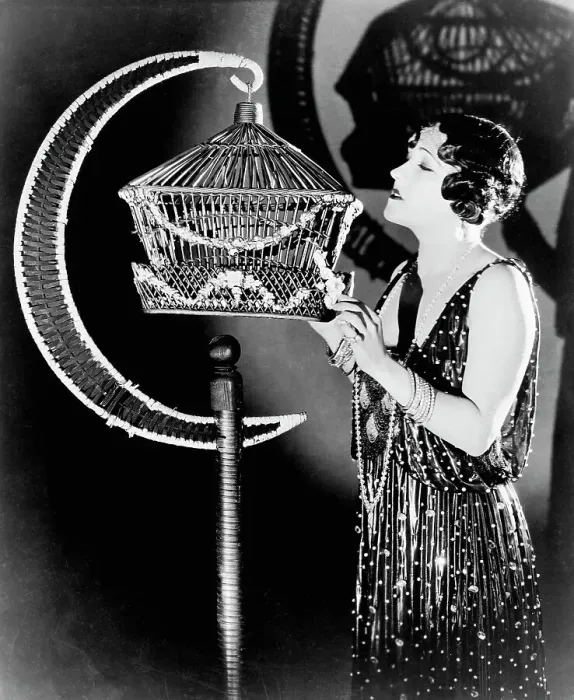 Framed Print : Actress Gloria Swanson Examining a Bird Cage