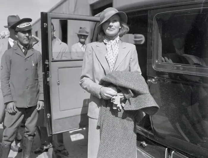 Framed Print : Actress Greta Garbo Pausing Outside Taxi