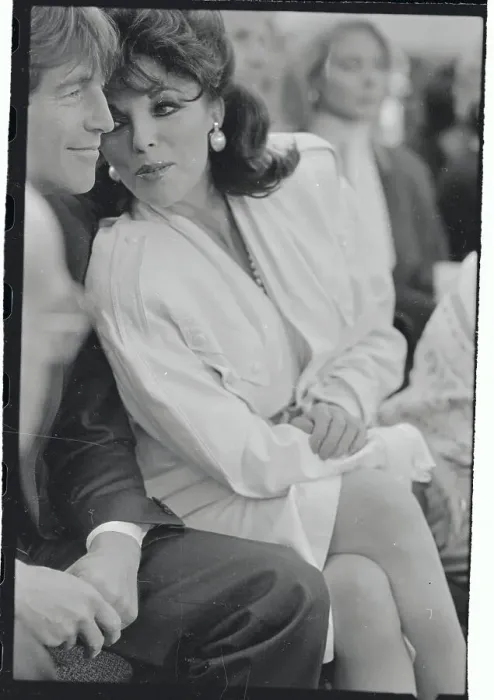 Framed Print : Actress Joan Collins Chatting with Escort Framed Print : Actress Joan Collins Chatting with Escort