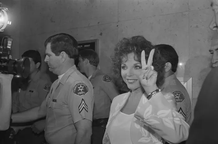 Framed Print : Actress Joan Collins Giving the Victory Sign Framed Print : Actress Joan Collins Giving the Victory Sign
