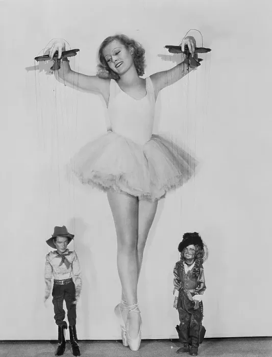 Framed Print : Actress Lilian Harvey Holding Puppets Framed Print : Actress Lilian Harvey Holding Puppets