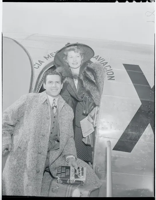 Framed Print : Actress Lucille Ball and Desi Arnaz Standing at Airplane Entrance