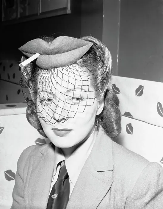 Framed Print : Actress Wearing Hat in Shape of Lips with Cigarette and Veil Framed Print : Actress Wearing Hat in Shape of Lips with Cigarette and Veil