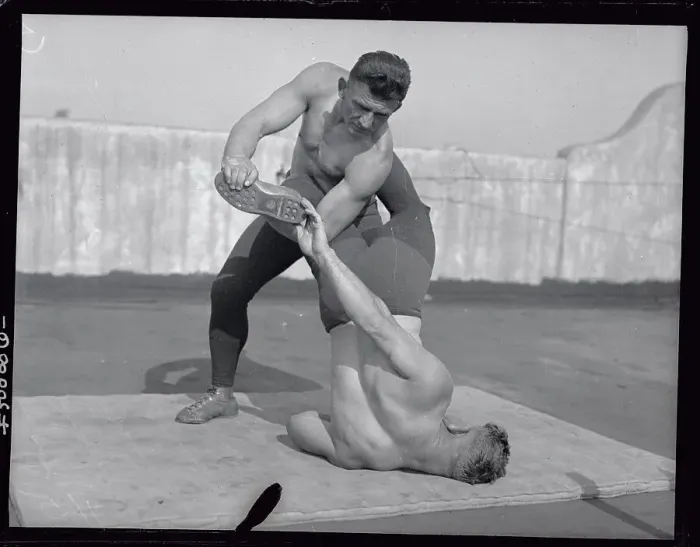 Framed Print : Ad Santel Wrestling with Opponent