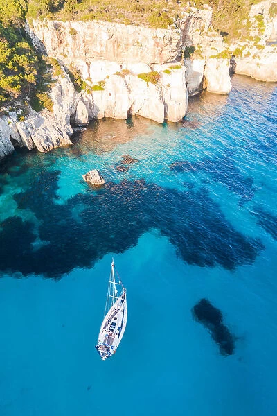 Aerial view of boat in the blue sea, Cala Macarella, Menorca