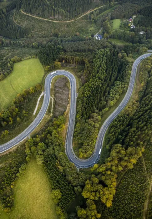 Framed Print : Aerial view, hairpin curves, winding road in the Sauerland forests, between Herscheid and Halver, North Rhine-Westphalia, Germany Framed Print : Aerial view, hairpin curves, winding road in the Sauerland forests, between Herscheid and Halver, North Rhine-Westphalia, Germany