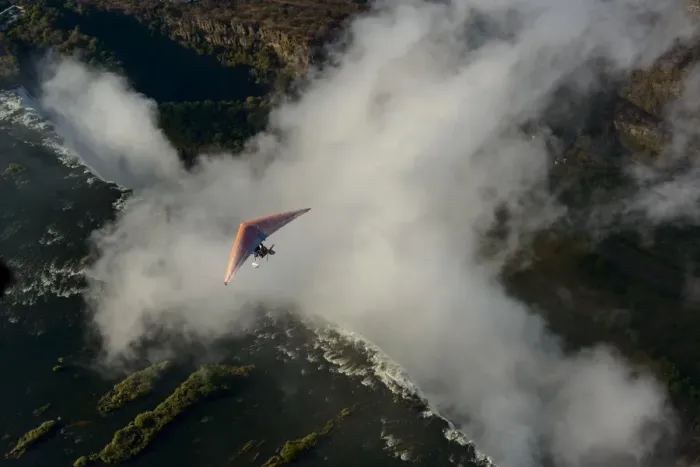 Framed Print : Aerial view of a micorlight (ultralight) flying over the Zambezi River and Victoria Falls. Livingstone. Zambia Framed Print : Aerial view of a micorlight (ultralight) flying over the Zambezi River and Victoria Falls. Livingstone. Zambia